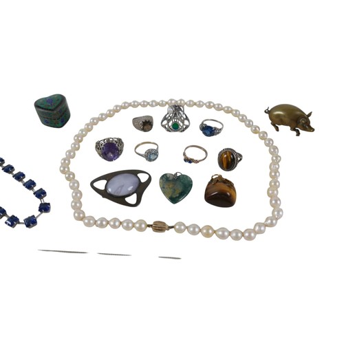 12 - An assortment of mainly costume jewellery and a brass pig. (1 bag)