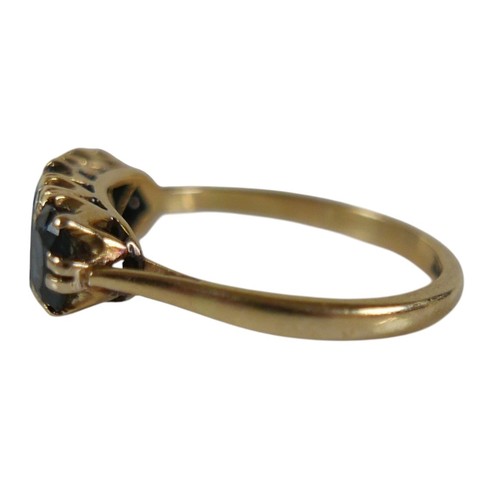 56 - An 18ct yellow gold sapphire and diamond ring set with three oval cut sapphires and four small diamo... 