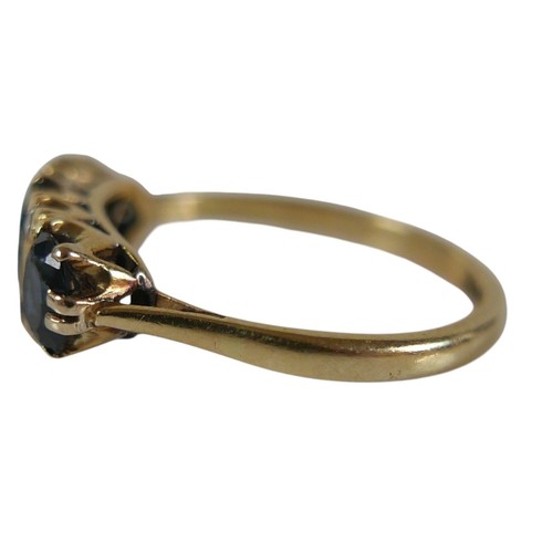 56 - An 18ct yellow gold sapphire and diamond ring set with three oval cut sapphires and four small diamo... 