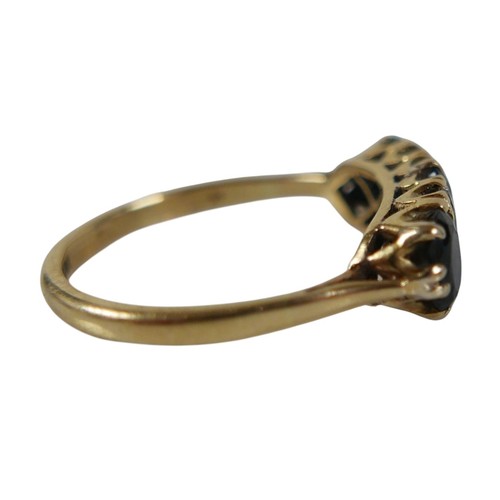 56 - An 18ct yellow gold sapphire and diamond ring set with three oval cut sapphires and four small diamo... 