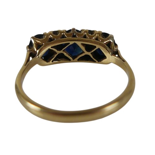 56 - An 18ct yellow gold sapphire and diamond ring set with three oval cut sapphires and four small diamo... 