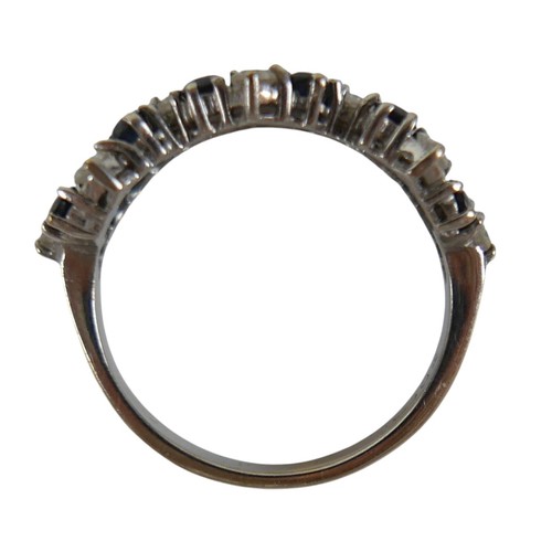 57 - An 18ct white gold diamond and sapphire ring set with twenty two interwoven stones, ring size O, wei... 