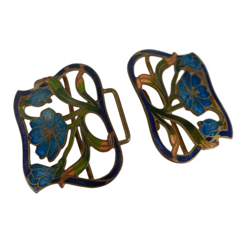 26 - Six pieces of enamel jewellery comprising a nurses buckle, single buckle, two ship brooches, a silve... 