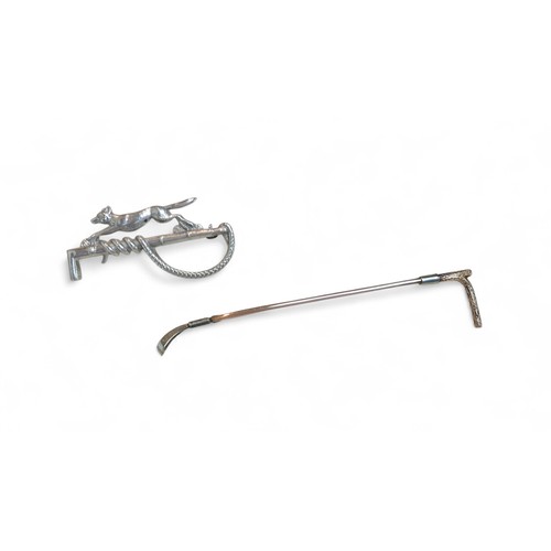 30 - A gold riding crop form brooch, stamped '14ct 9ct', 9cm long 3.7g, and a silver hunting themed brooc... 