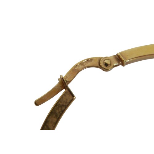 49 - Three pairs of 9ct gold earrings comprising a pair of white gold emerald studs, yellow gold hoop ear... 