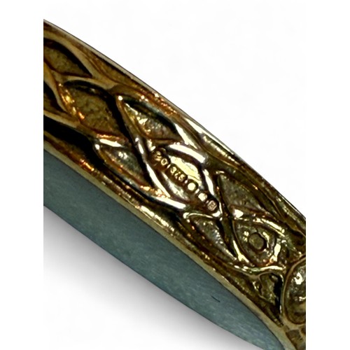 42 - A 9ct gold mother of pearl and hard stone inlaid pendant, 1.7 by 4cm, 7.9g.