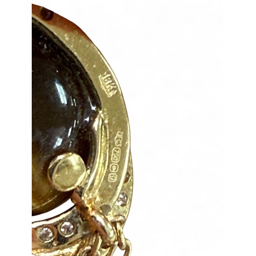 43 - A 18ct gold necklace with an 18ct gold tiger’s eye and diamond pendant, oval cut tiger's eye stone 1... 