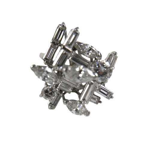 3 - A white gold and diamond set cluster ring, with a modernist asymmetric multi-level design, four marq... 