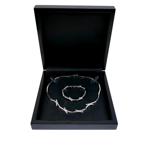 124 - A 14ct white gold and diamond semi rigid choker and matching bracelet, choker 44cm long, bracelet 17... 