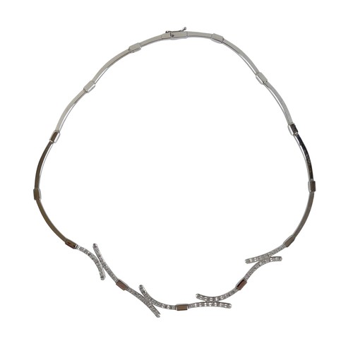 124 - A 14ct white gold and diamond semi rigid choker and matching bracelet, choker 44cm long, bracelet 17... 