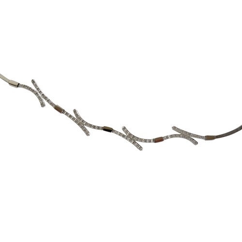 124 - A 14ct white gold and diamond semi rigid choker and matching bracelet, choker 44cm long, bracelet 17... 