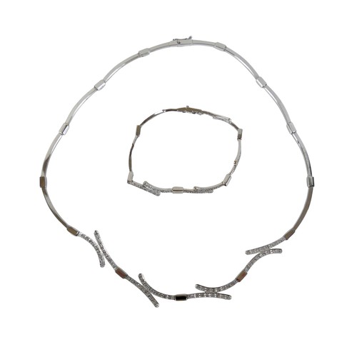 124 - A 14ct white gold and diamond semi rigid choker and matching bracelet, choker 44cm long, bracelet 17... 