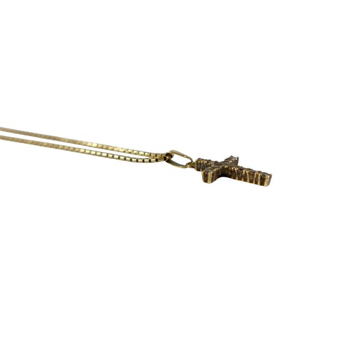 52 - A 9ct gold mounted crucifix pendant and 9ct chain, the cross set with eleven clear stones, total wei... 