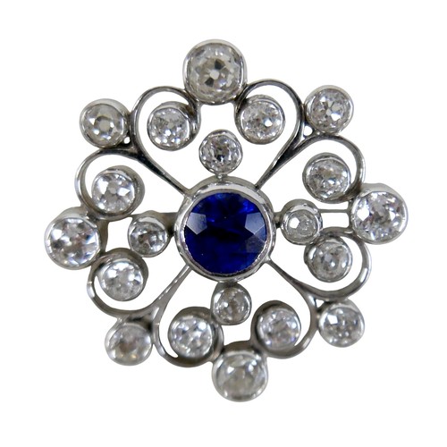123 - A white metal sapphire and diamond flower head brooch the central sapphire approximately 1.0ct, surr... 