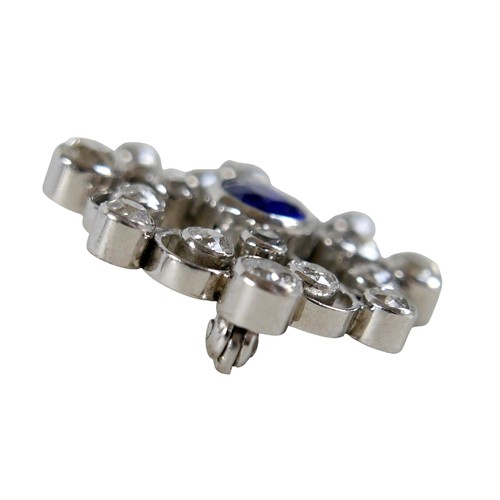 123 - A white metal sapphire and diamond flower head brooch the central sapphire approximately 1.0ct, surr... 