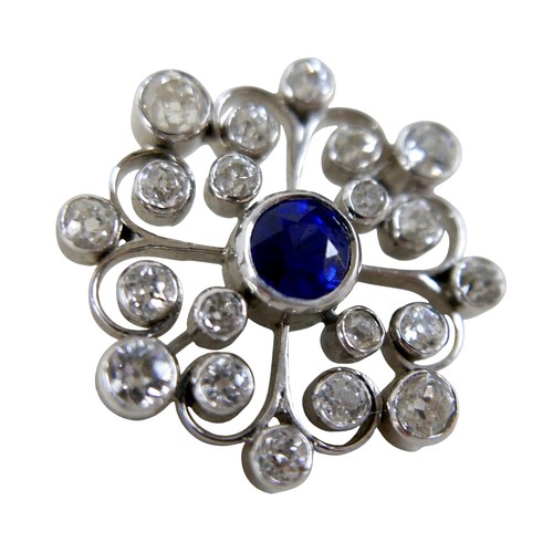 123 - A white metal sapphire and diamond flower head brooch the central sapphire approximately 1.0ct, surr... 