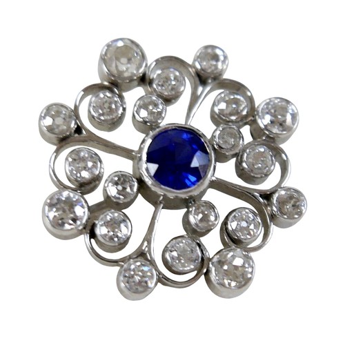123 - A white metal sapphire and diamond flower head brooch the central sapphire approximately 1.0ct, surr... 