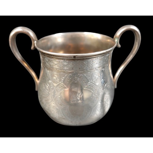 269 - A Victorian Scottish silver three piece tea service, of tapering baluster form, engraved foliate car... 