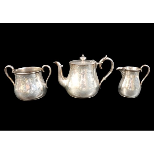 269 - A Victorian Scottish silver three piece tea service, of tapering baluster form, engraved foliate car... 