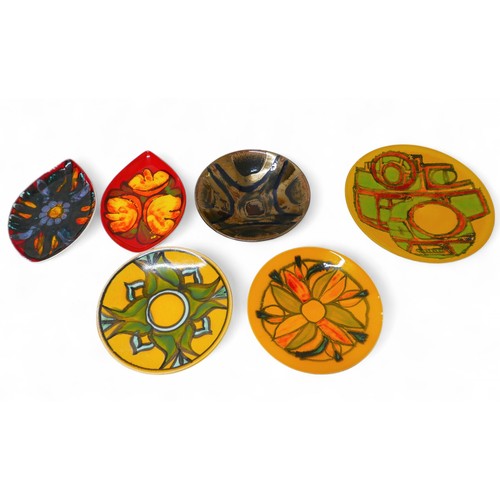 393 - A collection of five Poole Delphis plates and a bowl largest 35cm diameter.(6)