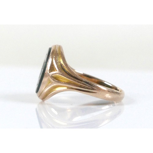 56 - An Edwardian yellow gold signet ring, inlaid with a green hard stone, rubbed hallmarks probably 15ct... 