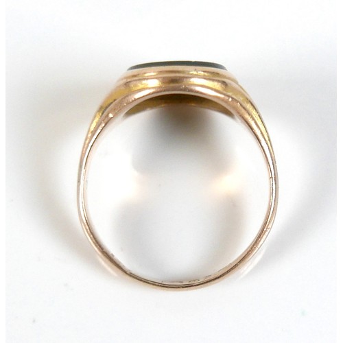 56 - An Edwardian yellow gold signet ring, inlaid with a green hard stone, rubbed hallmarks probably 15ct... 