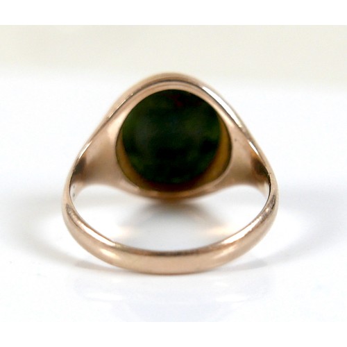 56 - An Edwardian yellow gold signet ring, inlaid with a green hard stone, rubbed hallmarks probably 15ct... 