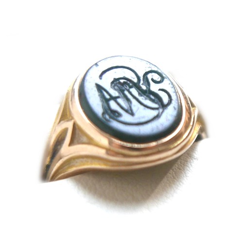 56 - An Edwardian yellow gold signet ring, inlaid with a green hard stone, rubbed hallmarks probably 15ct... 