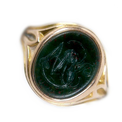 56 - An Edwardian yellow gold signet ring, inlaid with a green hard stone, rubbed hallmarks probably 15ct... 