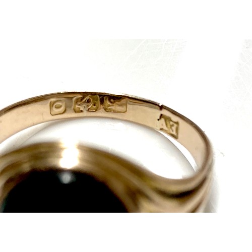 56 - An Edwardian yellow gold signet ring, inlaid with a green hard stone, rubbed hallmarks probably 15ct... 