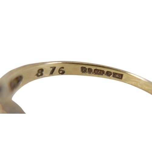 46 - Four 9ct gold rings, including a large pale blue oval cut stone ring with two small diamonds to its ... 