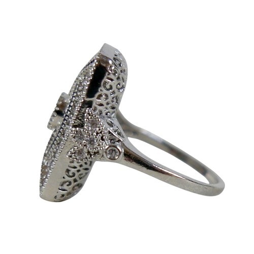 30 - A white metal Art Deco style dress ring, head size 23 by 17mm, size S, 7.6g.