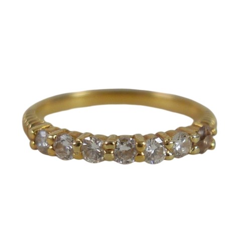 58 - An 18ct gold seven stone diamond ring, size N, 2.6g.