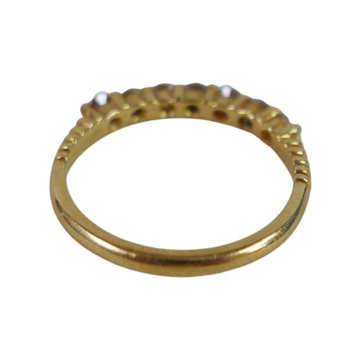 58 - An 18ct gold seven stone diamond ring, size N, 2.6g.