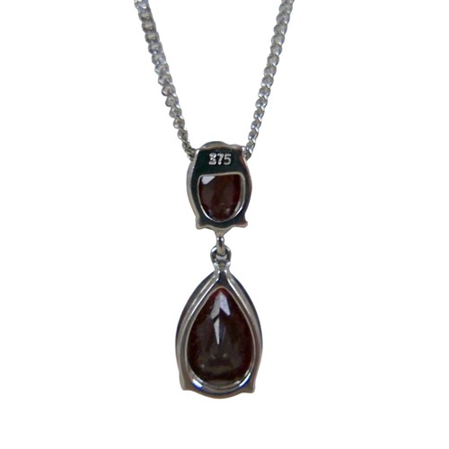 41 - A 9ct white gold garnet two stone pendant on a fine chain, pendant 30mm high, chain 46cm, 3.8g.