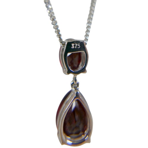 41 - A 9ct white gold garnet two stone pendant on a fine chain, pendant 30mm high, chain 46cm, 3.8g.