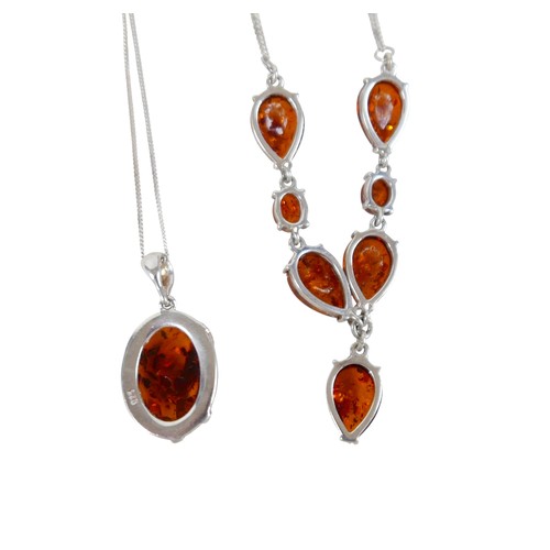 18 - A silver and amber necklace and pendant and chain, pendant 3cm high.(2)