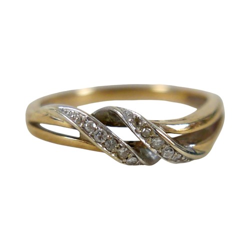 31 - An 18ct yellow and white gold crossover diamond ring size P, 2.3g.