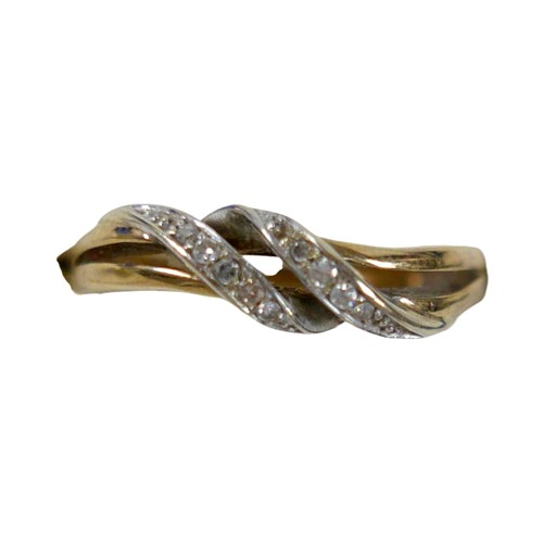 31 - An 18ct yellow and white gold crossover diamond ring size P, 2.3g.
