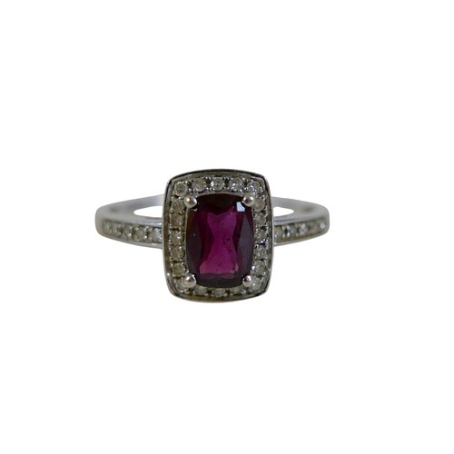32 - A 9ct white gold ruby and diamond ring size Q, head 19 by 17mm, 2.2g.