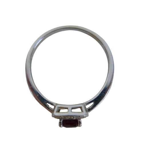 32 - A 9ct white gold ruby and diamond ring size Q, head 19 by 17mm, 2.2g.