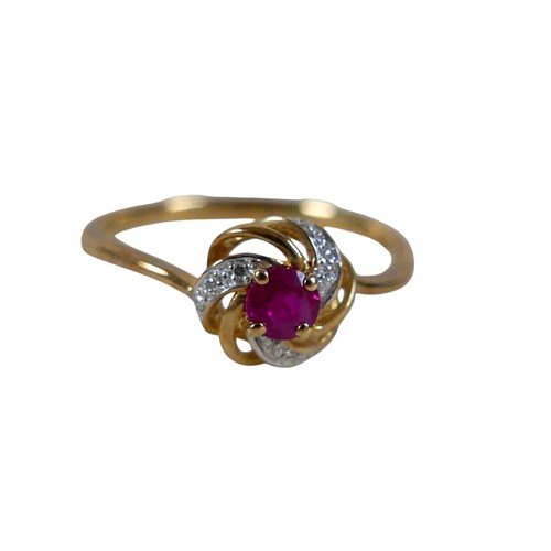 34 - A 9ct yellow gold ruby and diamond open swirl ring, head 17mm diameter, ring size Q, 1.8g.