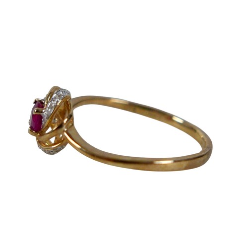 34 - A 9ct yellow gold ruby and diamond open swirl ring, head 17mm diameter, ring size Q, 1.8g.
