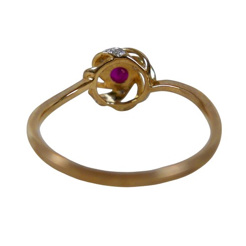 34 - A 9ct yellow gold ruby and diamond open swirl ring, head 17mm diameter, ring size Q, 1.8g.