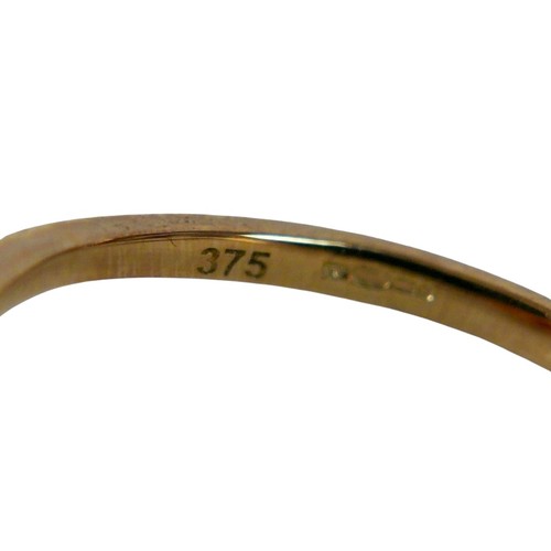 34 - A 9ct yellow gold ruby and diamond open swirl ring, head 17mm diameter, ring size Q, 1.8g.