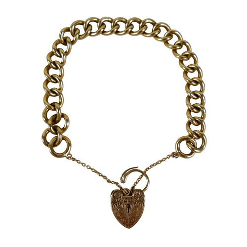 4 - A 9ct yellow gold kerb link bracelet with engraved heart shaped lock, links measure 18 by 12mm, 38.3... 