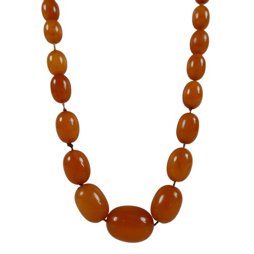 47 - Two butterscotch amber bead necklaces, both of forty five graduating beads, one with largest bead 22... 