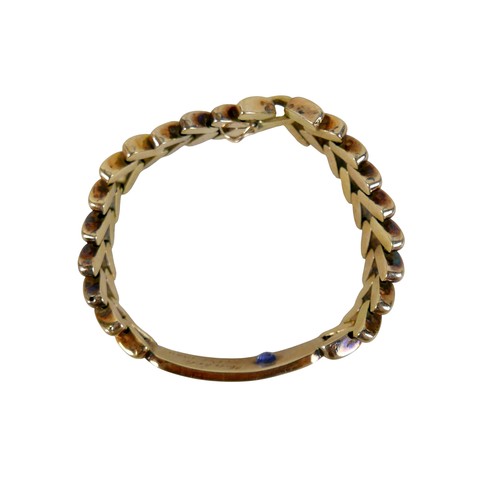 5 - A gold and sapphire identity bracelet, tested as 14ct appears to be stamped ‘14’, oval cut sapphire ... 