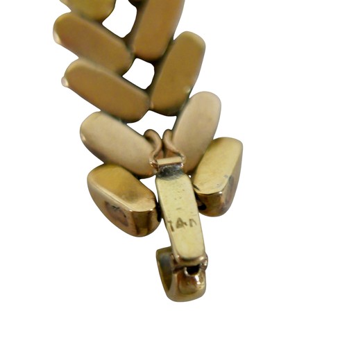 5 - A gold and sapphire identity bracelet, tested as 14ct appears to be stamped ‘14’, oval cut sapphire ... 