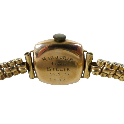 29 - A 9ct gold pair of earrings, 2g, together with a 9ct gold cased lady's cocktail watch with rolled go... 